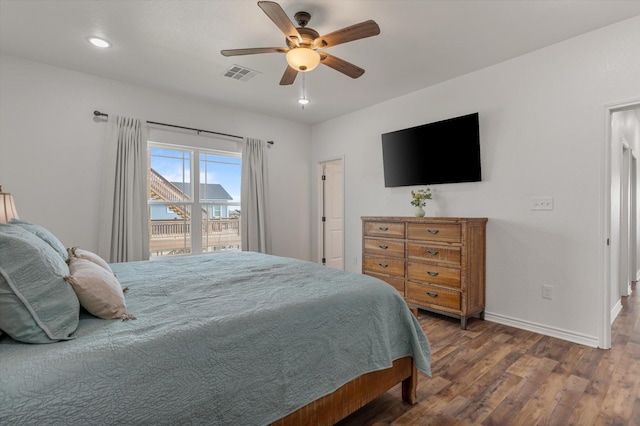 1023 N Bay St, Gilchrist, TX 77617 - bedroom featuring wood finished floors, baseboards, a ceiling fan, and recessed lighting