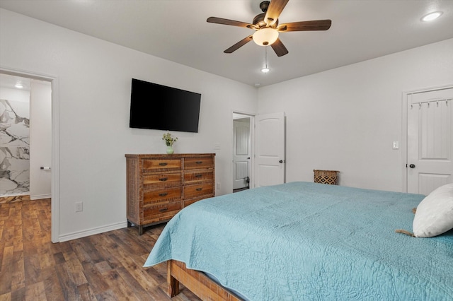 1023 N Bay St, Gilchrist, TX 77617 - bedroom featuring wood finished floors, baseboards, and ceiling fan