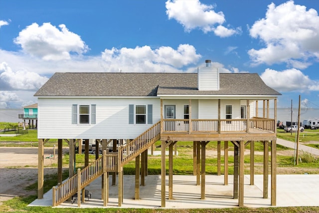 1023 N Bay St, Gilchrist, TX 77617 - view of jungle gym with stairway and covered porch