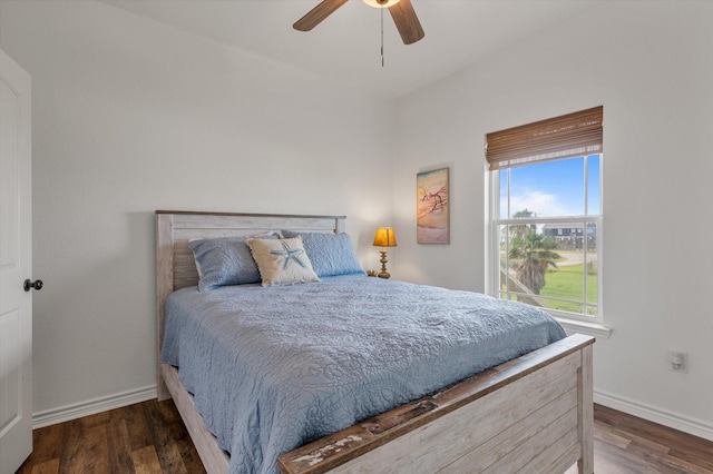 1023 N Bay St, Gilchrist, TX 77617 - bedroom featuring baseboards, wood finished floors, and a ceiling fan