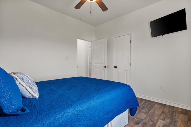 1023 N Bay St, Gilchrist, TX 77617 - bedroom featuring wood finished floors, a ceiling fan, and baseboards