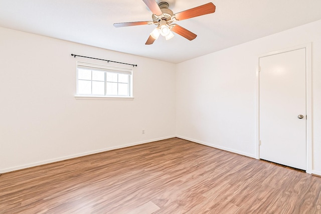 515 Tallowood Rd Unit 1, Houston, TX 77024 - spare room with light wood-style flooring, a ceiling fan, and baseboards
