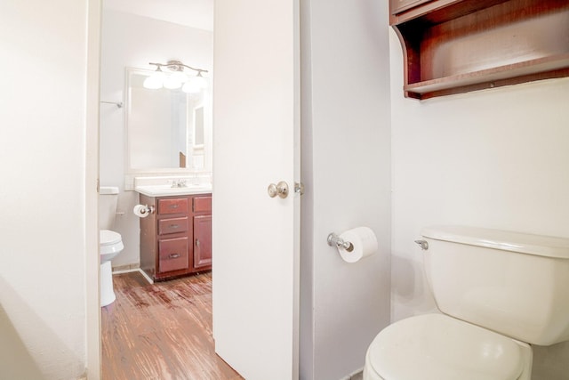 515 Tallowood Rd Unit 1, Houston, TX 77024 - half bath with toilet, wood finished floors, and vanity