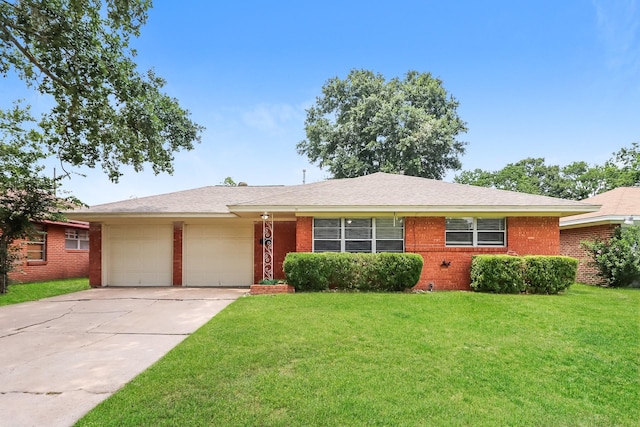 315 Eastlake St, Houston, TX 77034 - ranch-style house with an attached garage, a front yard, concrete driveway, and brick siding