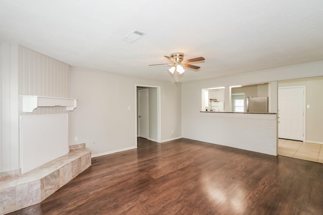 315 Eastlake St, Houston, TX 77034 - unfurnished living room with a ceiling fan, wood finished floors, and baseboards
