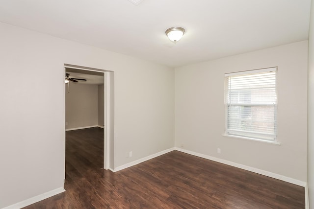 315 Eastlake St, Houston, TX 77034 - empty room featuring dark wood finished floors, baseboards, and a ceiling fan