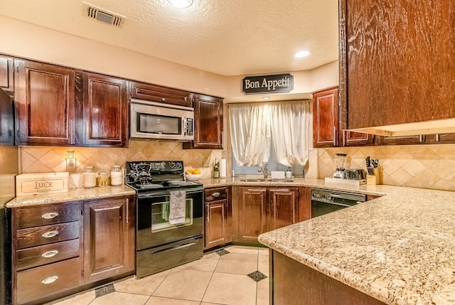 5200 Weslayan St Unit 108, Houston, TX 77005 - kitchen featuring black appliances, a sink, a textured ceiling, light stone counters, and decorative backsplash