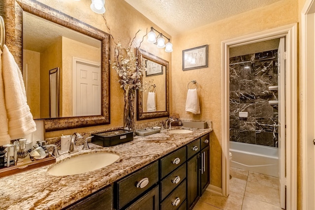 5200 Weslayan St Unit 108, Houston, TX 77005 - full bath featuring a textured ceiling, toilet, double vanity, tile patterned floors, and bathtub / shower combination