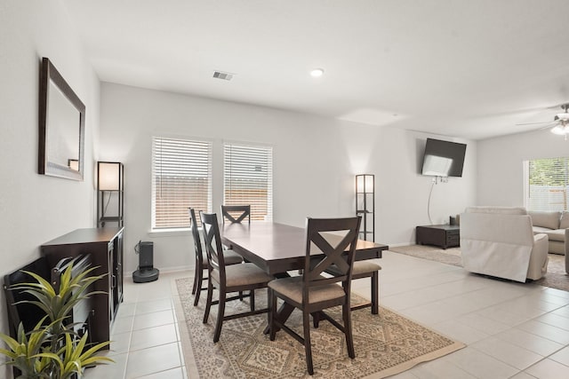 12022 Fletching Stone Ln, Houston, TX 77044 - dining room with light tile patterned floors, ceiling fan, baseboards, and recessed lighting