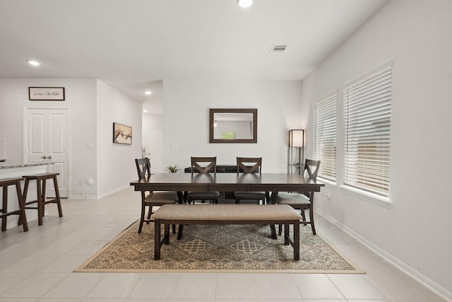 12022 Fletching Stone Ln, Houston, TX 77044 - dining area with light tile patterned flooring, recessed lighting, and baseboards