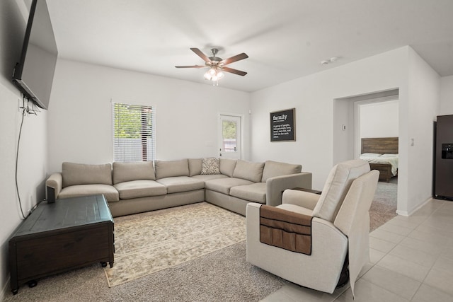 12022 Fletching Stone Ln, Houston, TX 77044 - living area with ceiling fan, light tile patterned floors, and baseboards