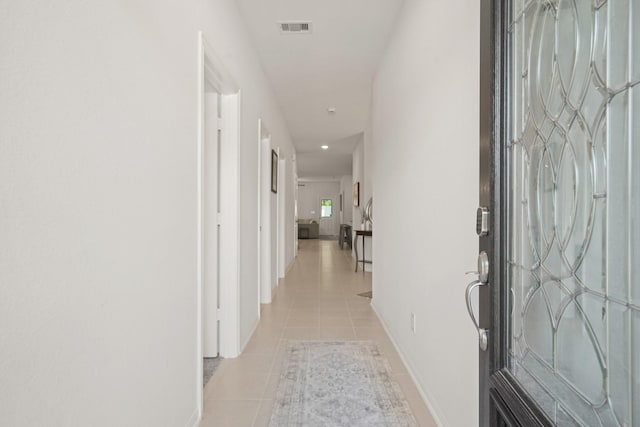 12022 Fletching Stone Ln, Houston, TX 77044 - hall with light tile patterned flooring, baseboards, and recessed lighting