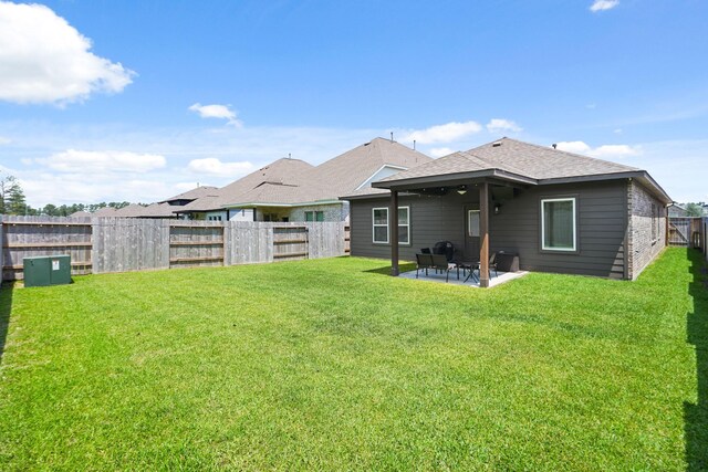 12022 Fletching Stone Ln, Houston, TX 77044 - back of house featuring a patio area and roof with shingles