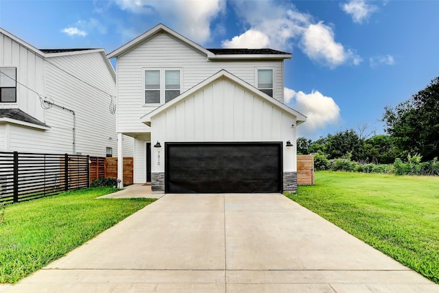 7810 Kenton St, Houston, TX 77028 - view of front of property with board and batten siding, stone siding, and concrete driveway