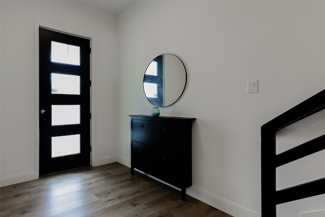 7810 Kenton St, Houston, TX 77028 - entryway featuring baseboards and wood finished floors