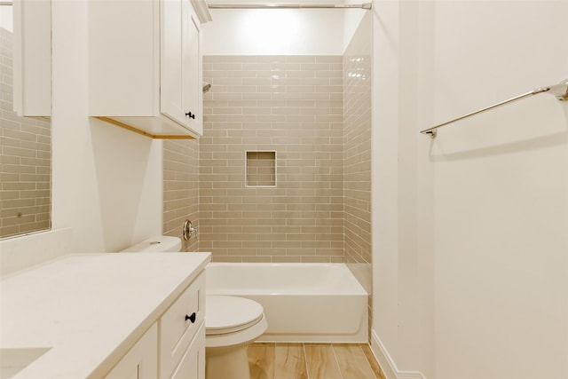 7810 Kenton St, Houston, TX 77028 - full bath featuring toilet, vanity, bathtub / shower combination, and wood finished floors