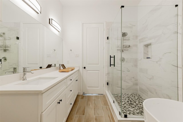 7810 Kenton St, Houston, TX 77028 - full bath featuring a stall shower, double vanity, and a freestanding bath
