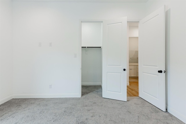 7810 Kenton St, Houston, TX 77028 - unfurnished bedroom featuring carpet flooring, baseboards, a spacious closet, and a closet