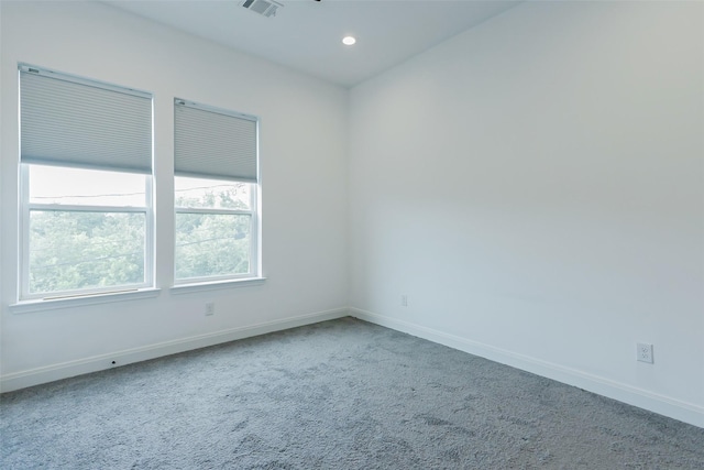 7810 Kenton St, Houston, TX 77028 - empty room with baseboards, carpet flooring, and recessed lighting