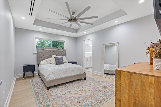 18215 Hereford Ln, Houston, TX 77058 - bedroom featuring a tray ceiling, light wood-style floors, recessed lighting, baseboards, and ceiling fan