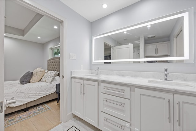 18215 Hereford Ln, Houston, TX 77058 - ensuite bathroom featuring double vanity and recessed lighting