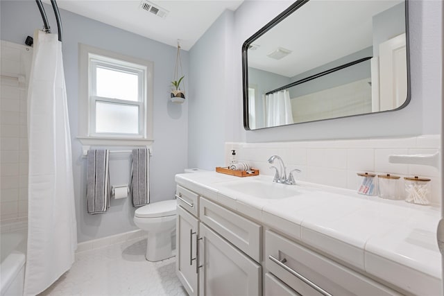 18215 Hereford Ln, Houston, TX 77058 - bathroom with vanity, toilet, shower / bathtub combination with curtain, and backsplash