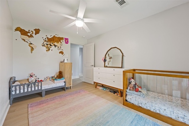 18215 Hereford Ln, Houston, TX 77058 - bedroom with wood finished floors, baseboards, and ceiling fan