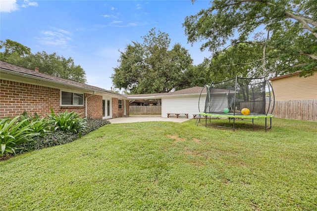18215 Hereford Ln, Houston, TX 77058 - view of yard featuring a trampoline and a patio