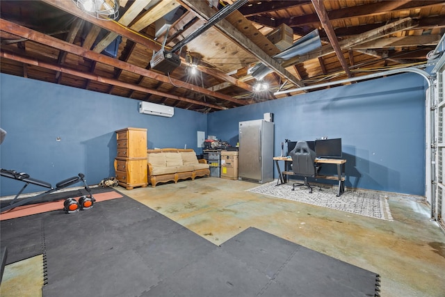 18215 Hereford Ln, Houston, TX 77058 - below grade area with a wall mounted AC, a garage, freestanding refrigerator, and a desk