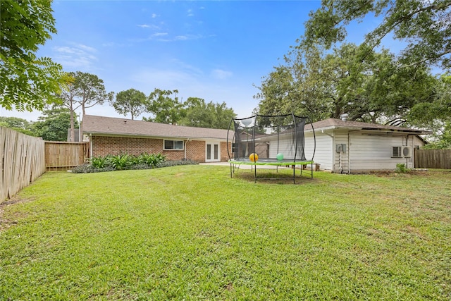 18215 Hereford Ln, Houston, TX 77058 - view of yard with a trampoline and ac unit