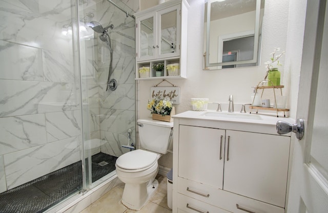20507 Hillsdale Park Dr, Cypress, TX 77433 - bathroom with toilet, a marble finish shower, vanity, and tile patterned floors