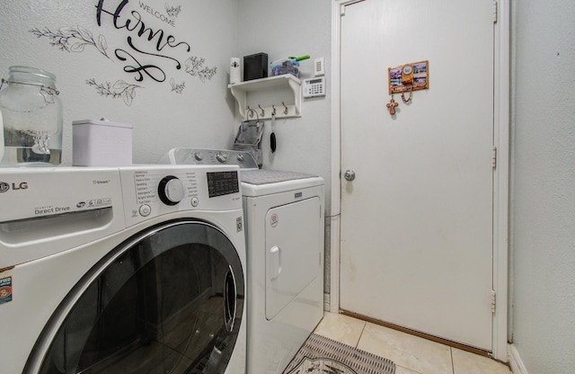 20507 Hillsdale Park Dr, Cypress, TX 77433 - laundry room featuring washer and dryer and light tile patterned floors