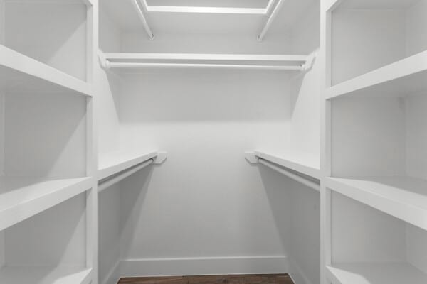 10719 Carlota Ct, Houston, TX 77096 - walk in closet with dark wood finished floors