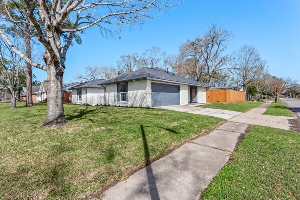 10719 Carlota Ct, Houston, TX 77096 - single story home featuring concrete driveway and a garage