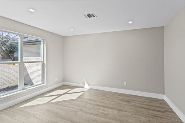 10719 Carlota Ct, Houston, TX 77096 - spare room with baseboards, light wood-style flooring, and recessed lighting