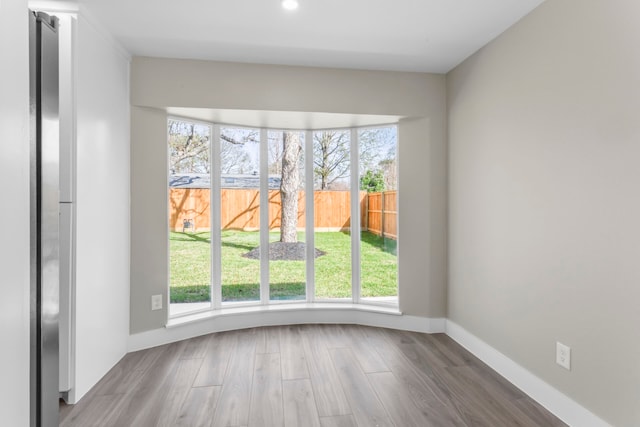 10719 Carlota Ct, Houston, TX 77096 - unfurnished dining area with wood finished floors and recessed lighting