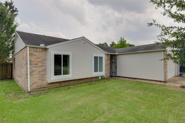 15803 Pryor Dr, Houston, TX 77489 - rear view of house with roof with shingles and an attached garage