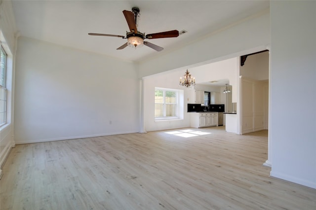 15803 Pryor Dr, Houston, TX 77489 - unfurnished living room with a chandelier, light wood finished floors, a ceiling fan, and baseboards