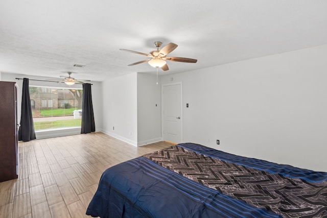 9222 New Forest Rd, Spring, TX 77379 - bedroom featuring wood finished floors, ceiling fan, and baseboards
