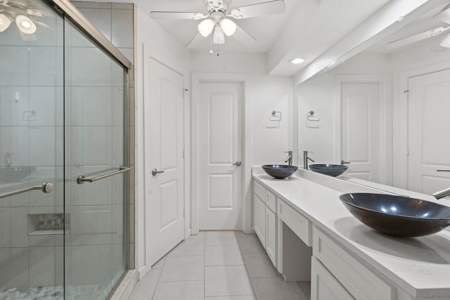 9222 New Forest Rd, Spring, TX 77379 - full bathroom with a ceiling fan, double vanity, tile patterned floors, and a shower stall
