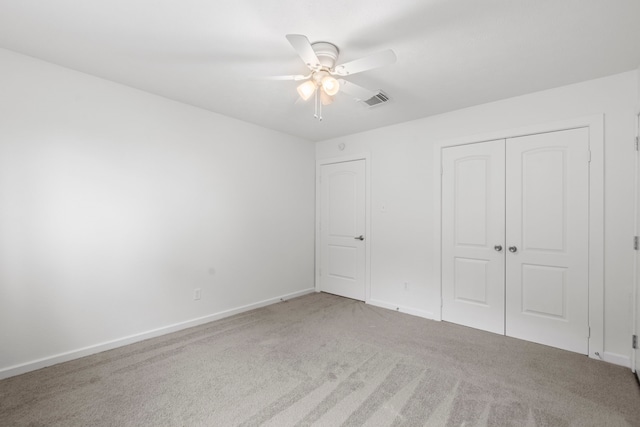 9222 New Forest Rd, Spring, TX 77379 - unfurnished bedroom with carpet floors, a closet, baseboards, and ceiling fan