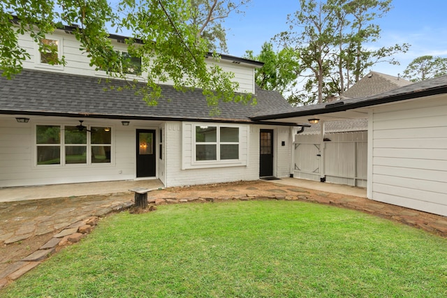 9222 New Forest Rd, Spring, TX 77379 - view of front of property with a shingled roof, a front lawn, and a patio