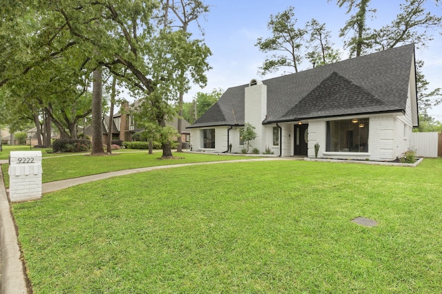 9222 New Forest Rd, Spring, TX 77379 - view of front facade with roof with shingles, a chimney, and brick siding