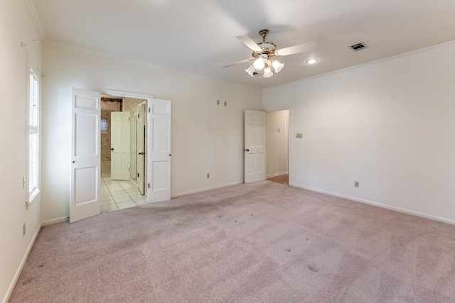18 Village Hill Dr, Conroe, TX 77304 - unfurnished bedroom featuring carpet flooring, ornamental molding, baseboards, connected bathroom, and a ceiling fan