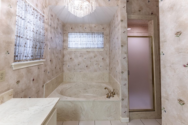 18 Village Hill Dr, Conroe, TX 77304 - full bathroom with a chandelier, a bath, tile patterned floors, vanity, and a stall shower