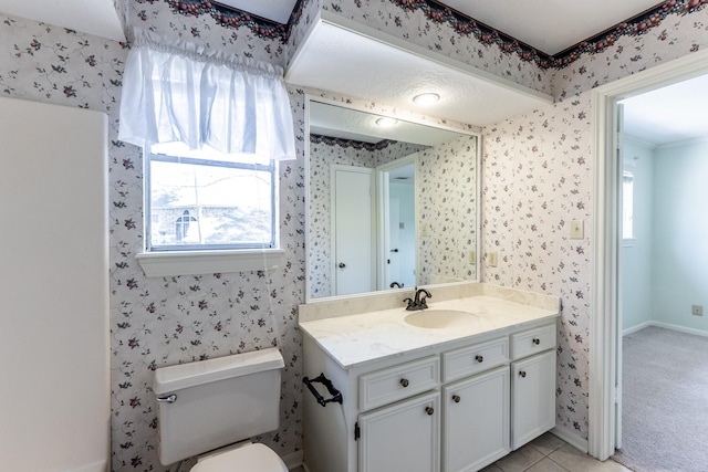 18 Village Hill Dr, Conroe, TX 77304 - bathroom featuring wallpapered walls, vanity, toilet, and baseboards