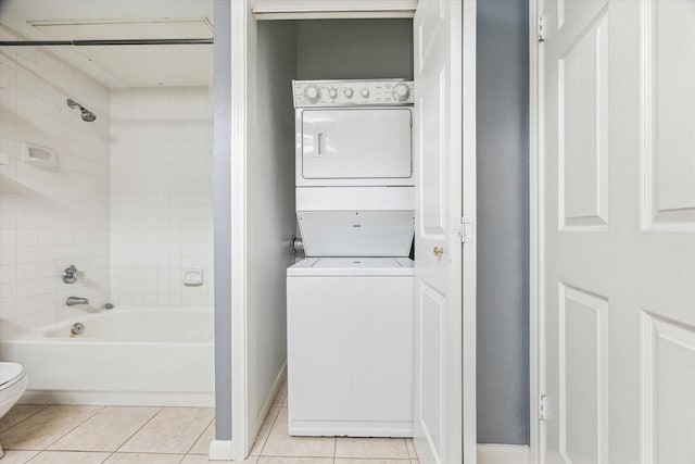 3231 Allen Pkwy Unit 6205, Houston, TX 77019 - laundry room with estacked washer and dryer, light tile patterned floors, and baseboards