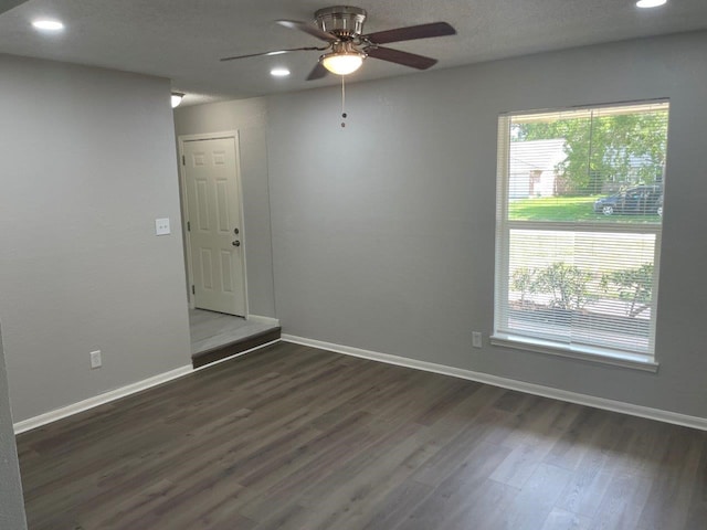 19414 Leafwood Ln, Houston, TX 77084 - unfurnished room with dark wood-style flooring, ceiling fan, recessed lighting, and baseboards