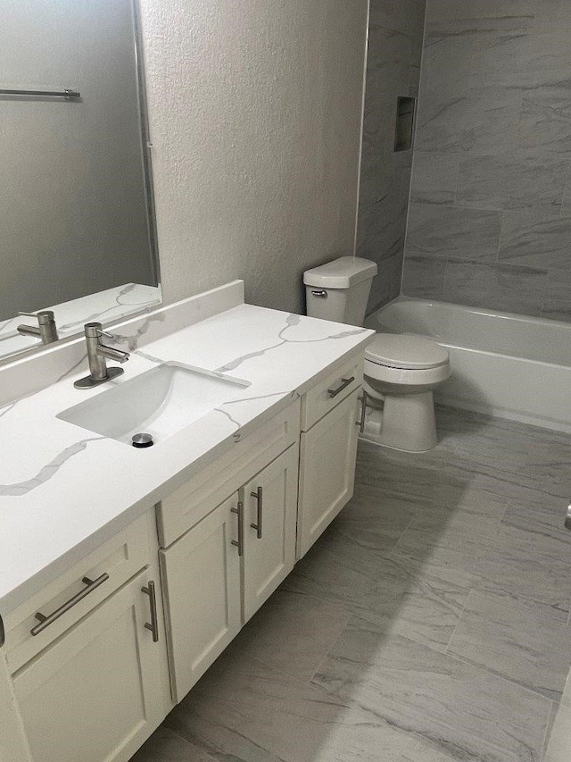 19414 Leafwood Ln, Houston, TX 77084 - bathroom with vanity, toilet, a textured wall, and shower / tub combination
