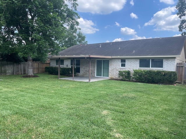 19414 Leafwood Ln, Houston, TX 77084 - rear view of property featuring a patio area, brick siding, and roof with shingles